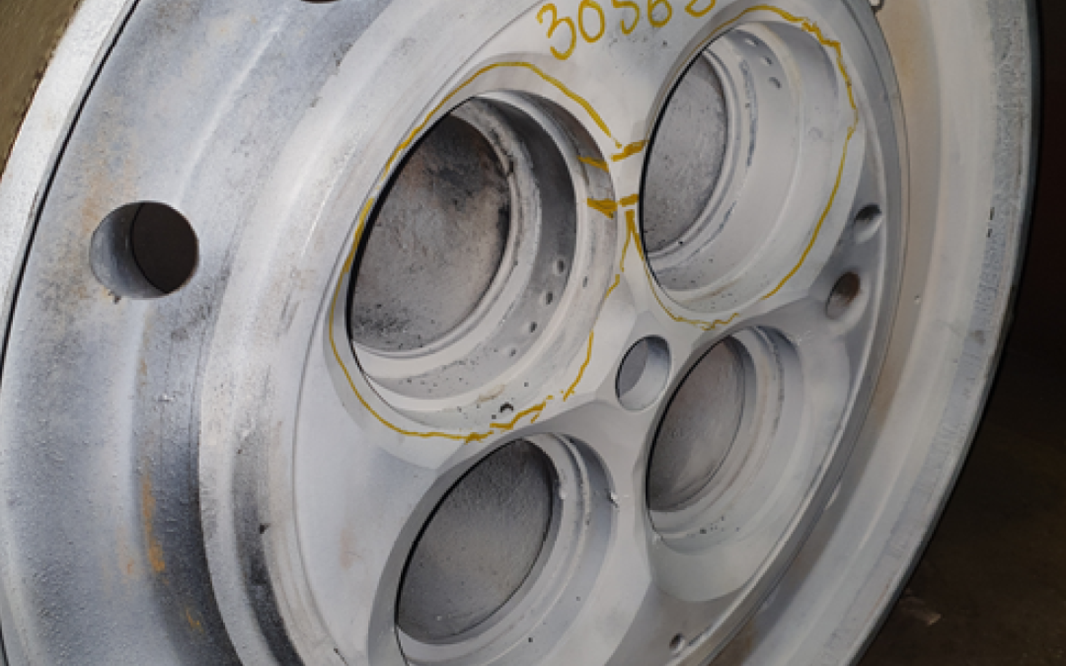 Wartsila Cylinder Head Valve Seat pockets before repair from Cast Iron Welding Services