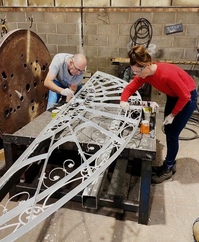Marie Palmer the Cast Iron Welding Services Director gets involved with the painting of a historic window welding restoration