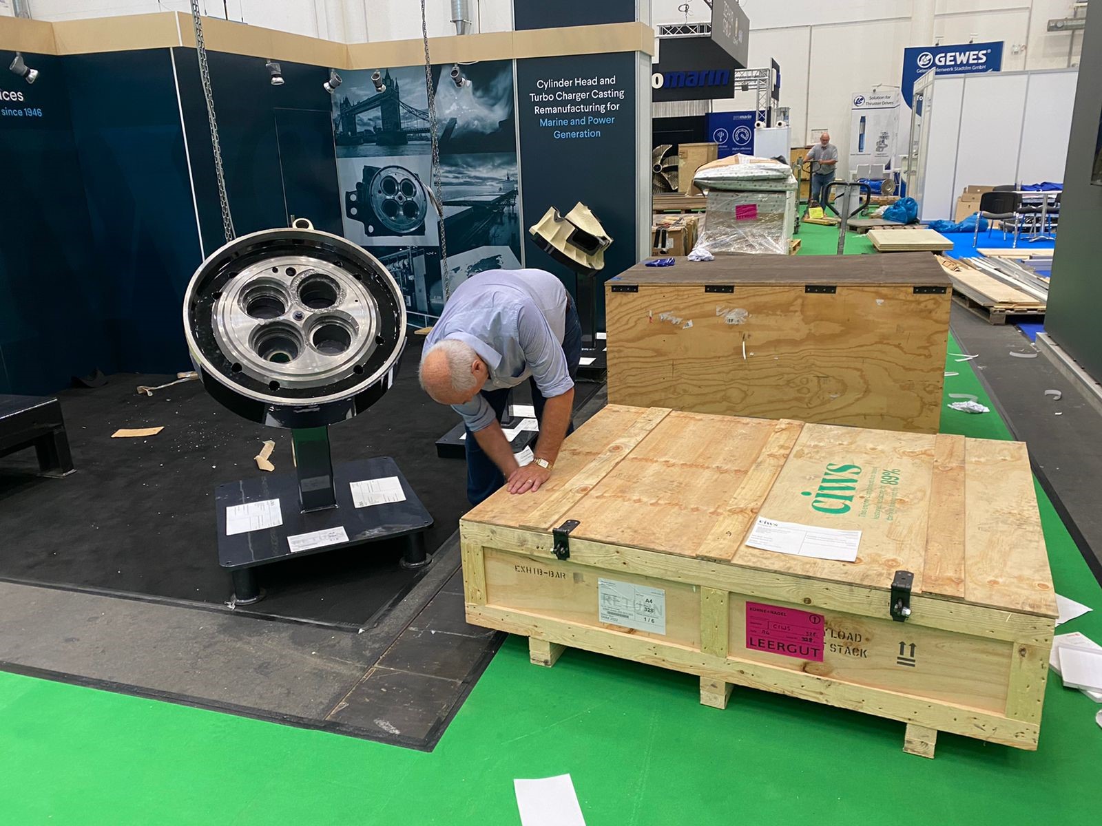 Setting up a maritime exhibition stand for cylinder head refurbishment projects